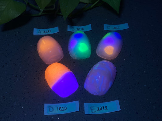 a group of four glowing eggs sitting on top of a table